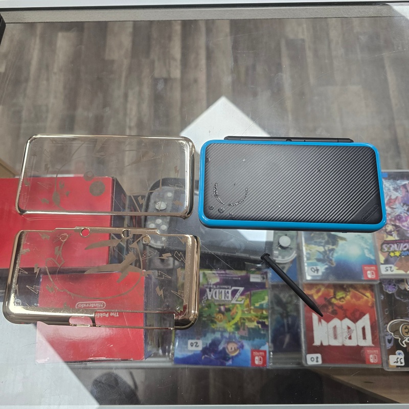 “New” Nintendo 2DS XL Handheld System With Charger and Homebrew Installed with Digital Games (Comes with Pikachu Speical Case Cover)